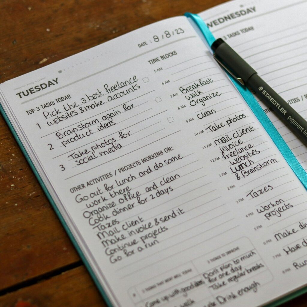 time blocking for entrepreneurs showing a notebook with a pen on top of it