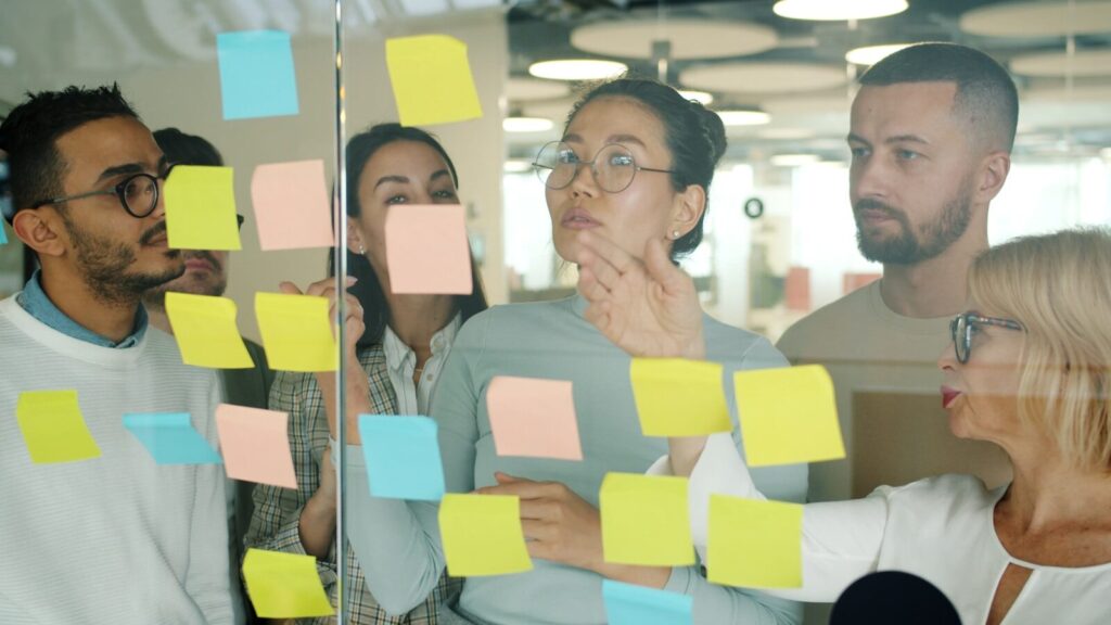 Team reviewing business troubleshooting mistakes