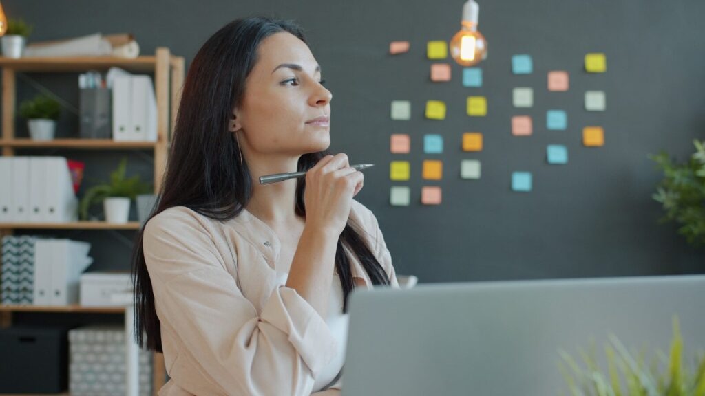 A woman thinking about decision making in business