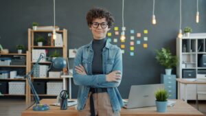 A woman entrepreneur smiles following through on business goals